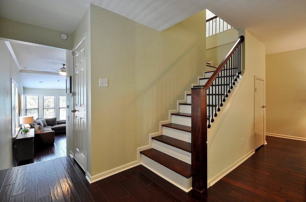 735 Patterson Avenue Austin, TX 78703 - Photo 7 of 15 a view of a hallway with wooden floor and stairs