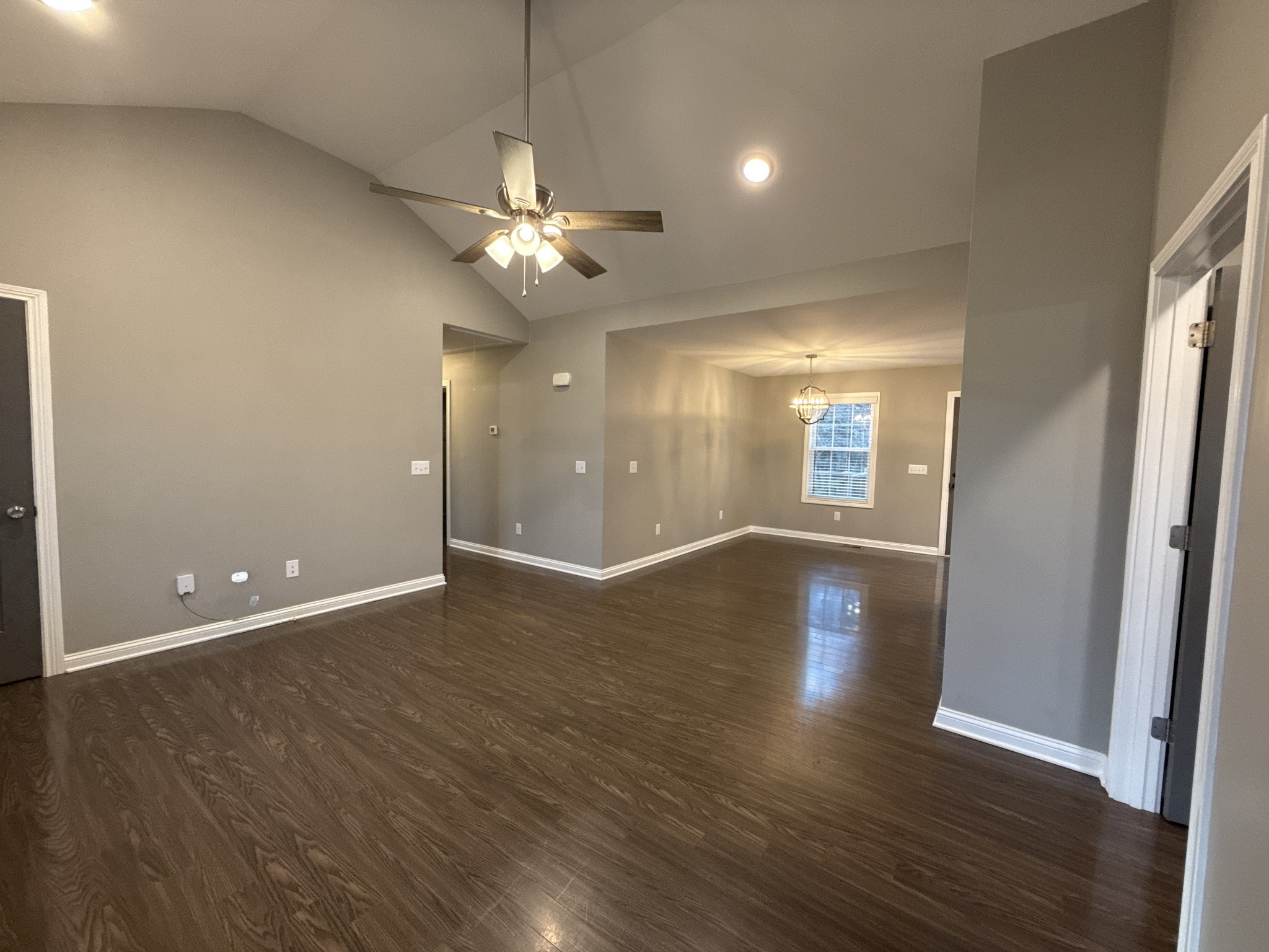 145 East Carter Road Portland, TN 37148 - Photo 3 of 24 an empty room with wooden floor and windows