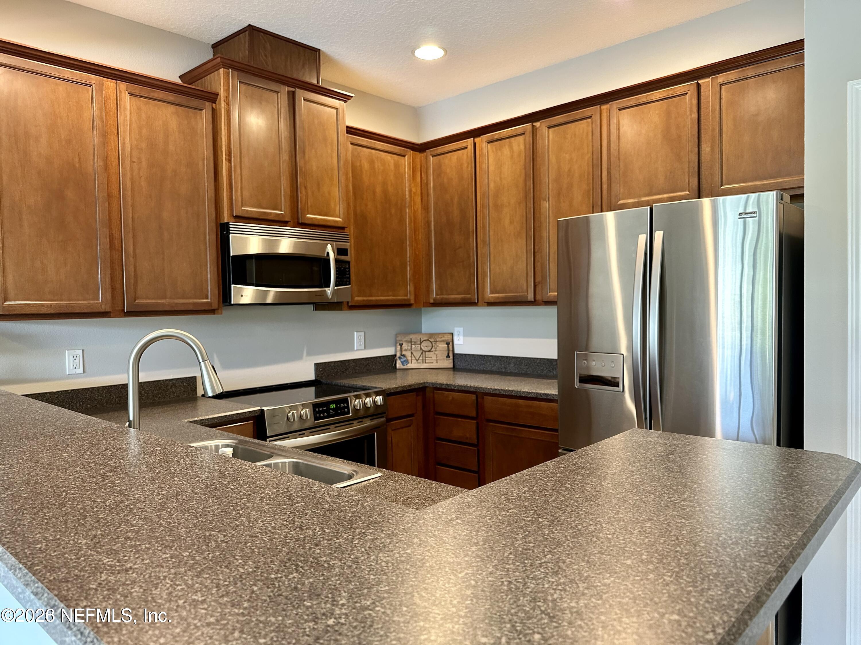 12946 Spring Rain Road Jacksonville, FL 32258 - Photo 6 of 25 KITCHEN