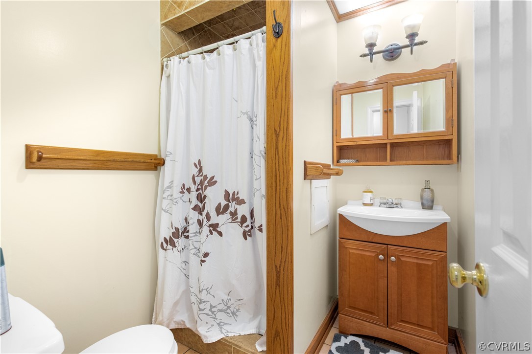 11311 Beach Road Chesterfield, VA 23838 - Photo 16 of 50 First Floor full bath with walk in tile shower.