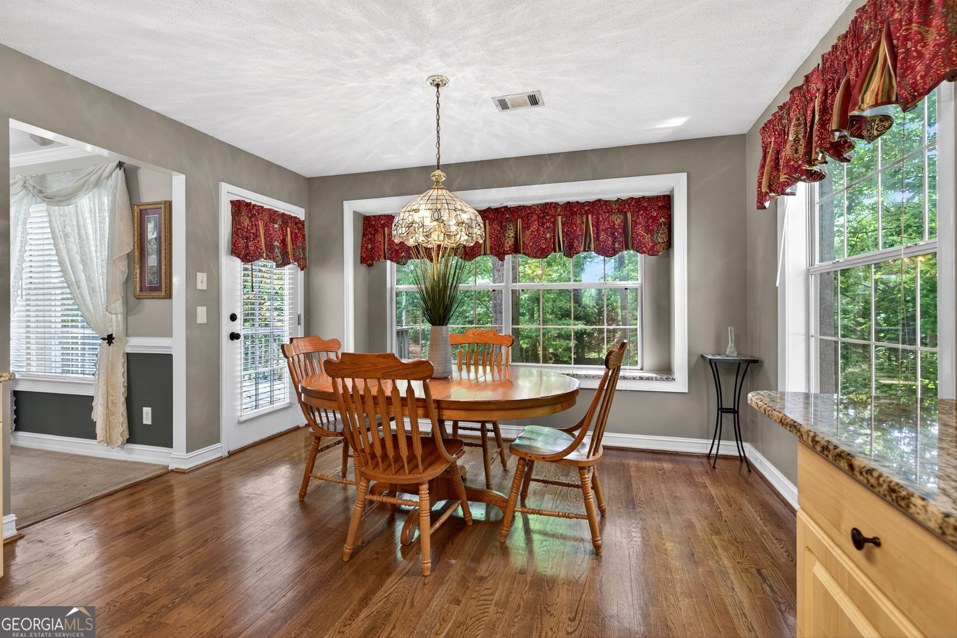 101 Emerald Lane Hampton, GA 30228 - Photo 17 of 72 a dining room with furniture window wooden floor