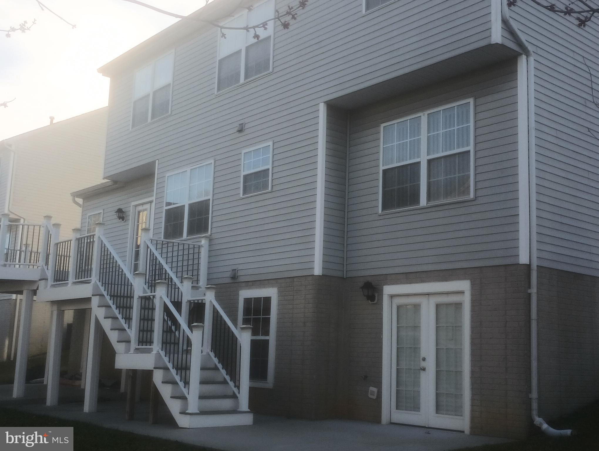 4023 Paige View Road Randallstown, MD 21133 - Photo 2 of 2 a front view of a house with stairs