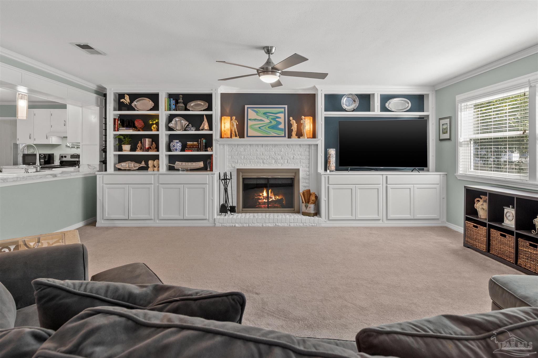 6001 Hilltop Road Pensacola, FL 32504 - Photo 12 of 37 a living room with furniture and a flat screen tv