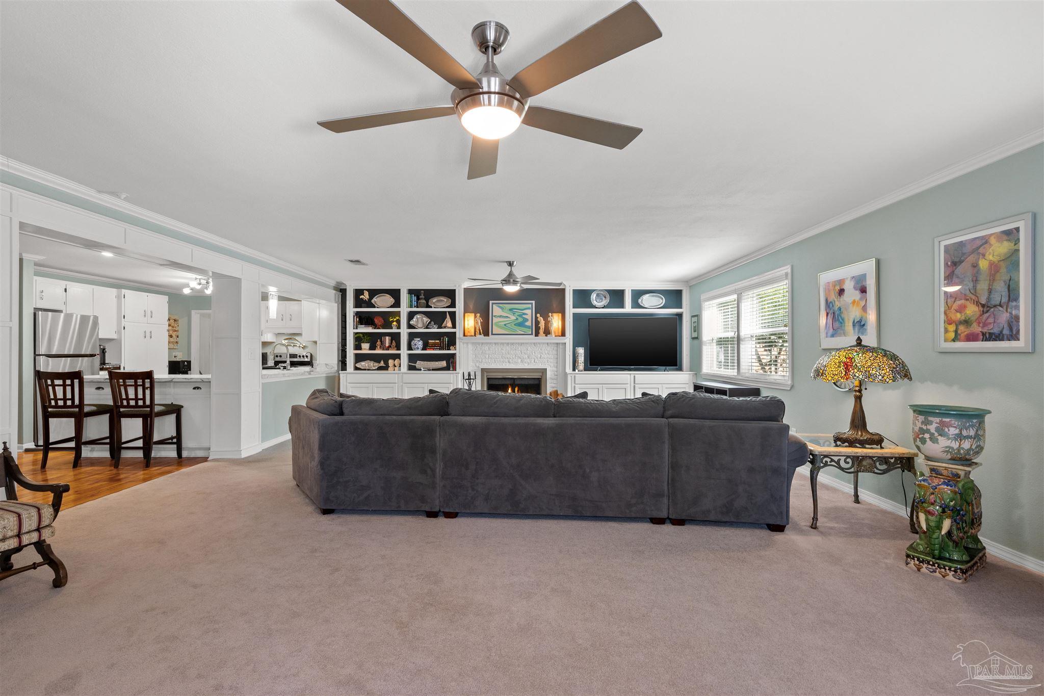 6001 Hilltop Road Pensacola, FL 32504 - Photo 13 of 37 a living room with furniture and a flat screen tv