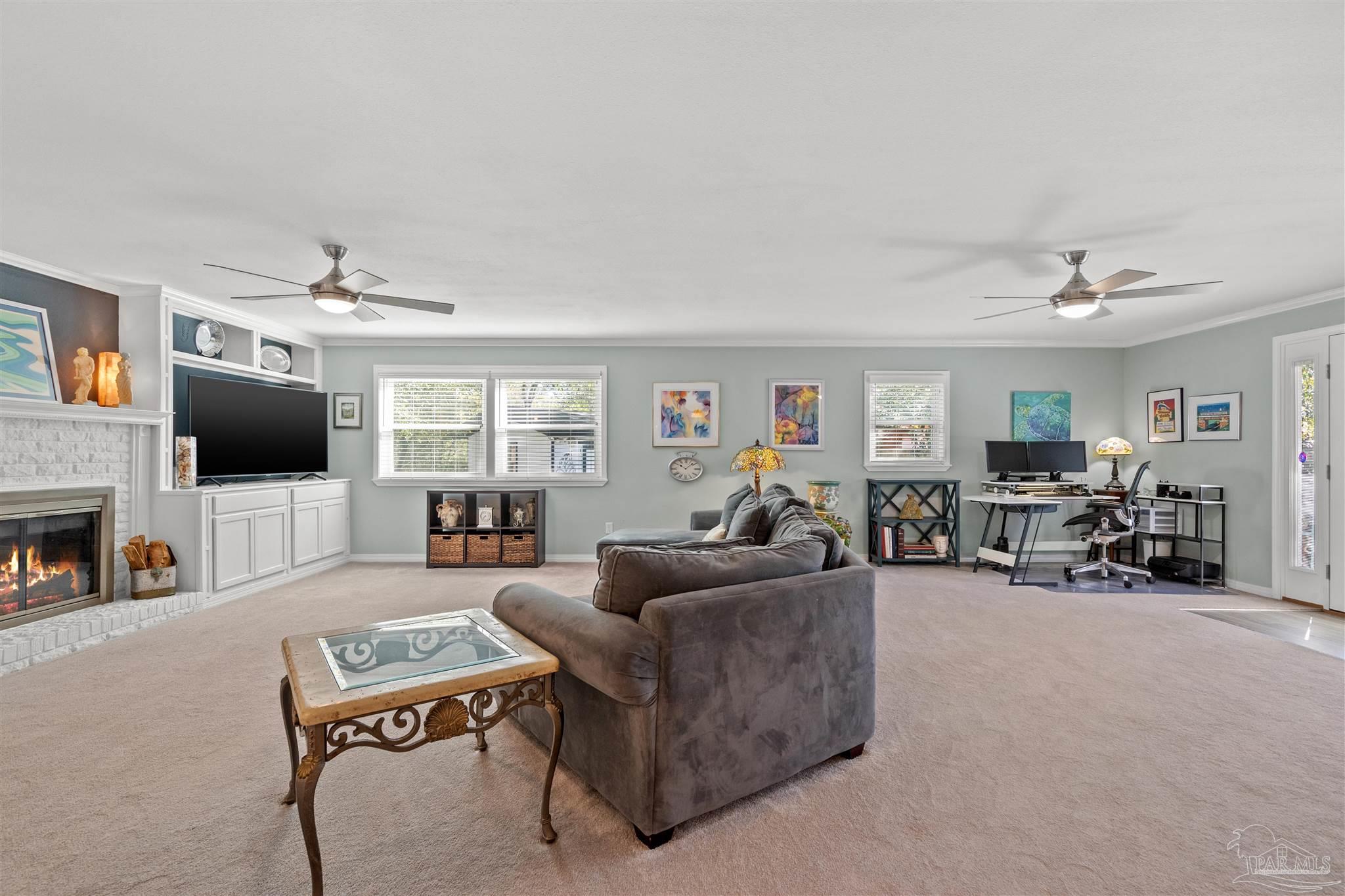 6001 Hilltop Road Pensacola, FL 32504 - Photo 15 of 37 a living room with furniture and a flat screen tv