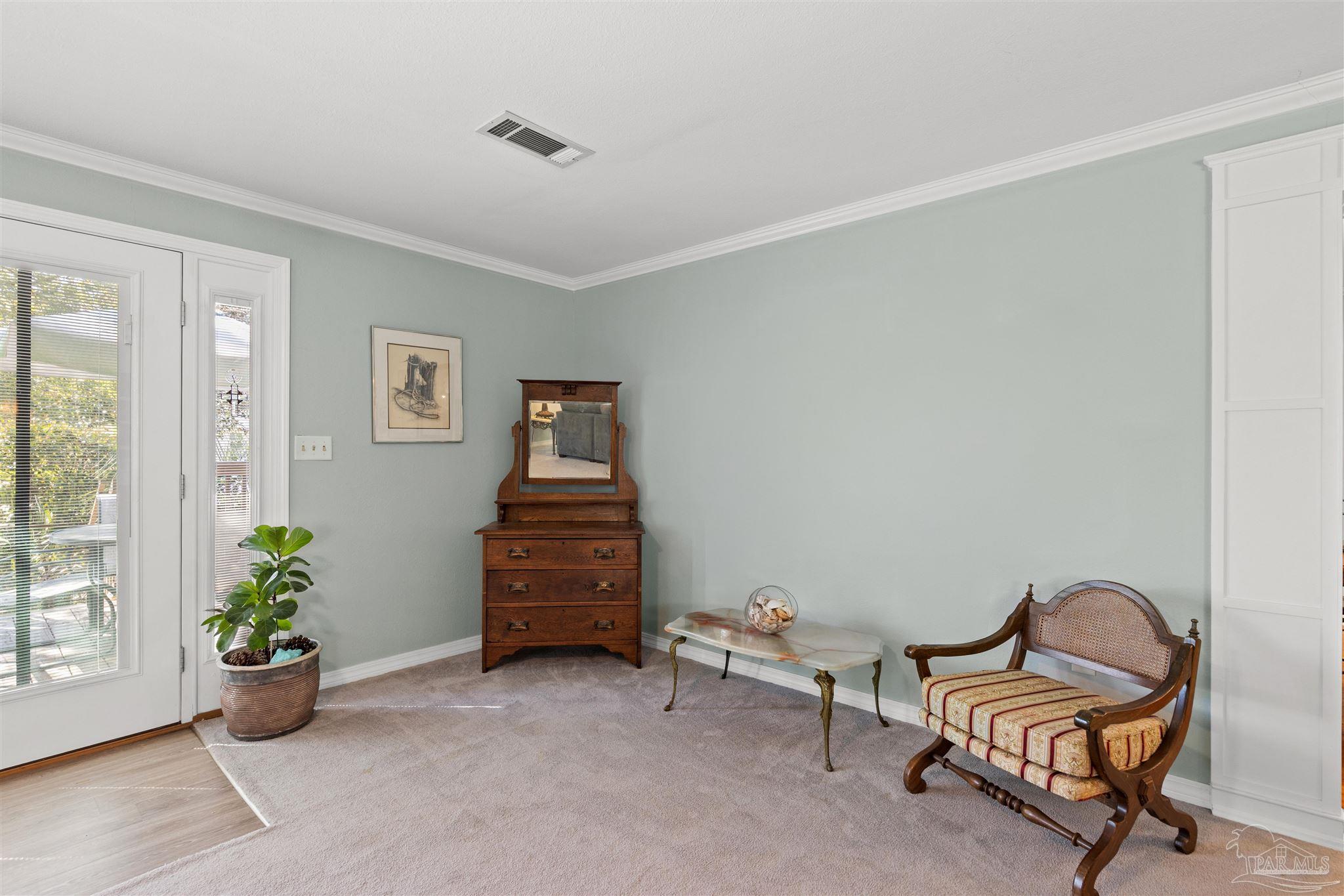 6001 Hilltop Road Pensacola, FL 32504 - Photo 16 of 37 a view of a room with chair and tables