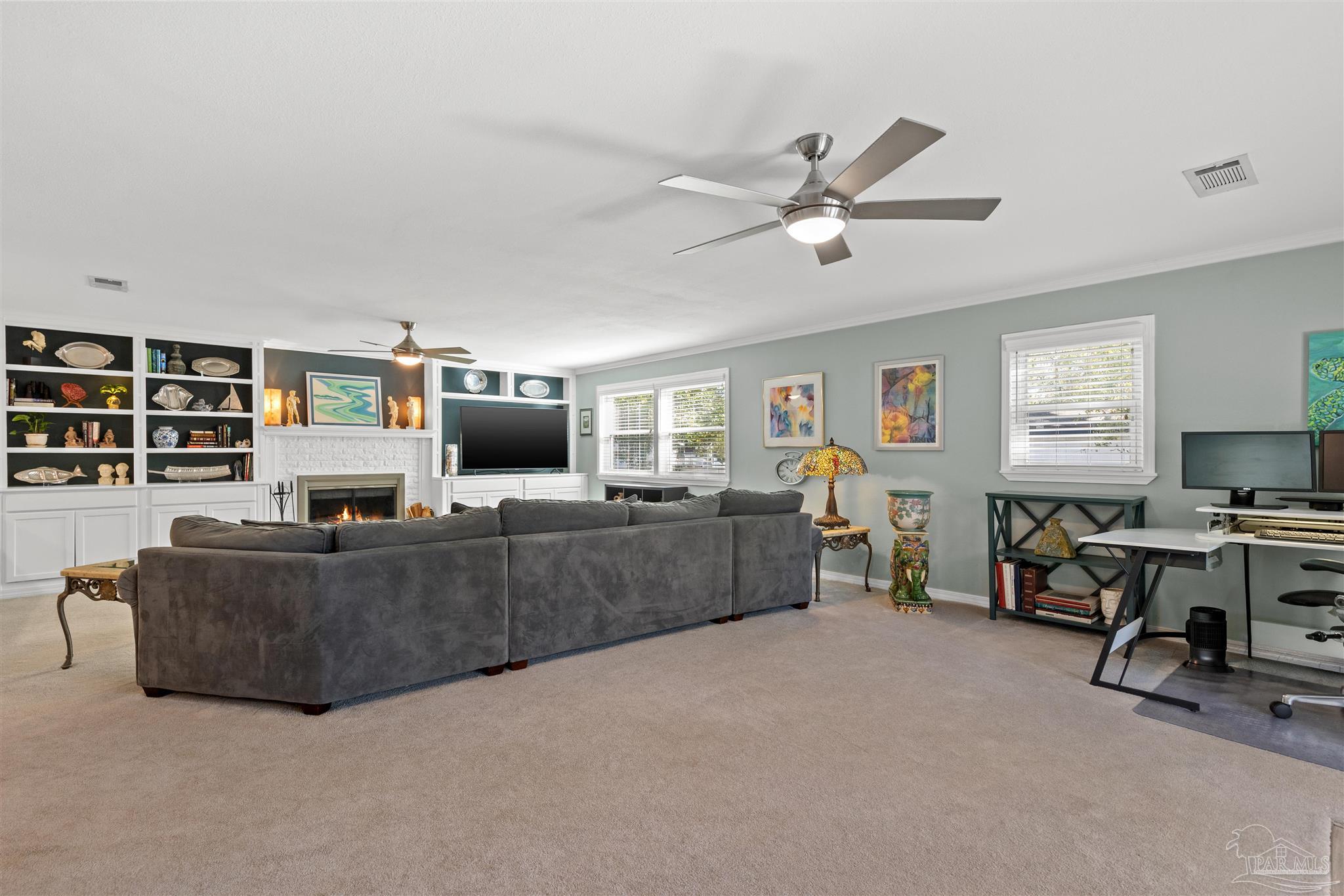 6001 Hilltop Road Pensacola, FL 32504 - Photo 18 of 37 a living room with furniture and a flat screen tv