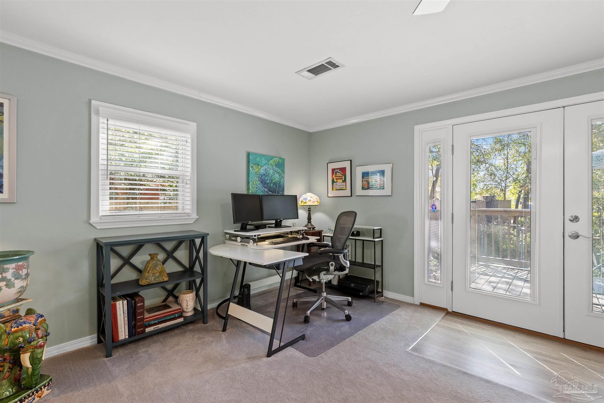 6001 Hilltop Road Pensacola, FL 32504 - Photo 19 of 37 a view of a workspace with lounge chair and a window
