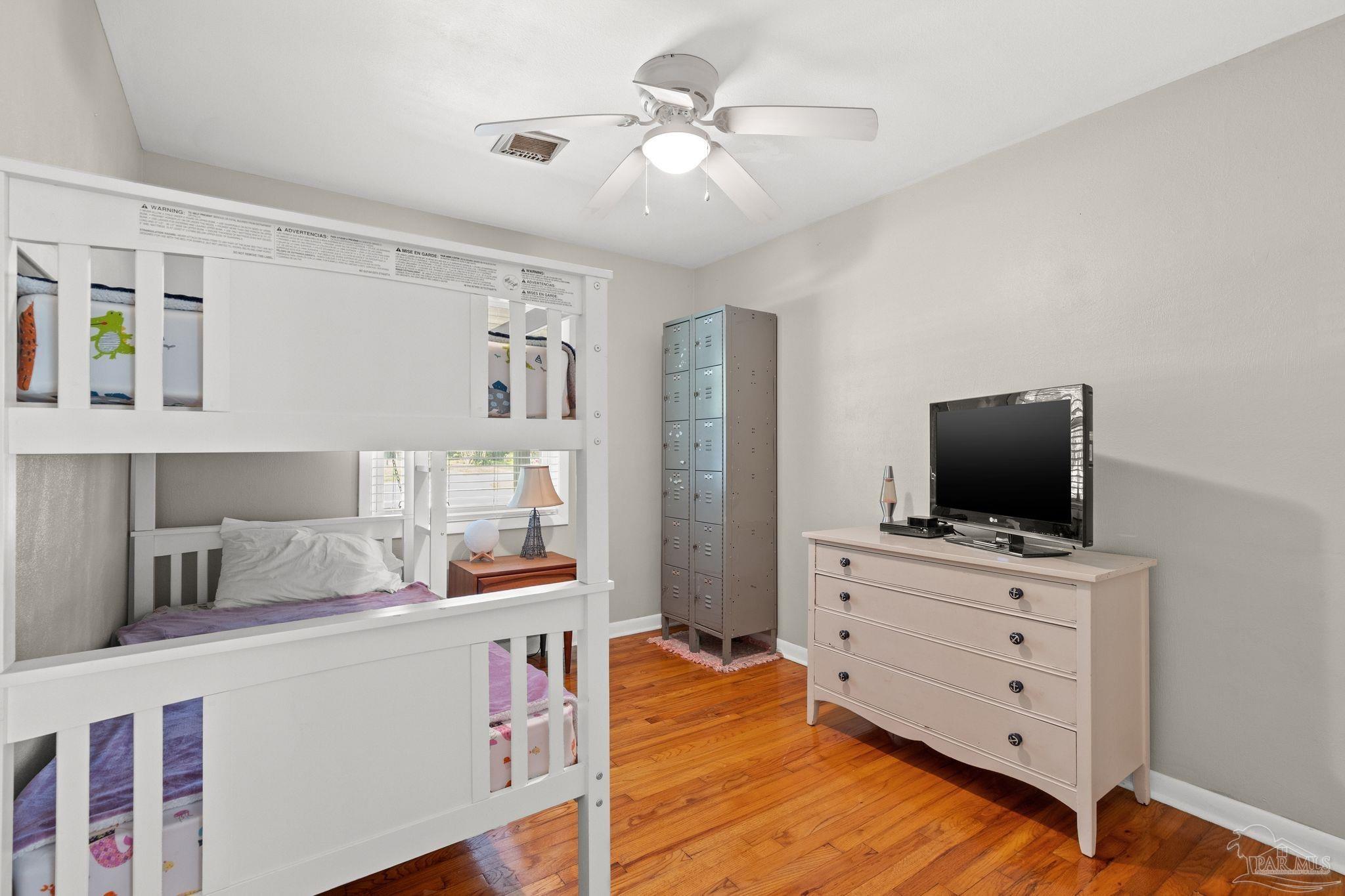 6001 Hilltop Road Pensacola, FL 32504 - Photo 20 of 37 a living room with furniture and flat screen tv
