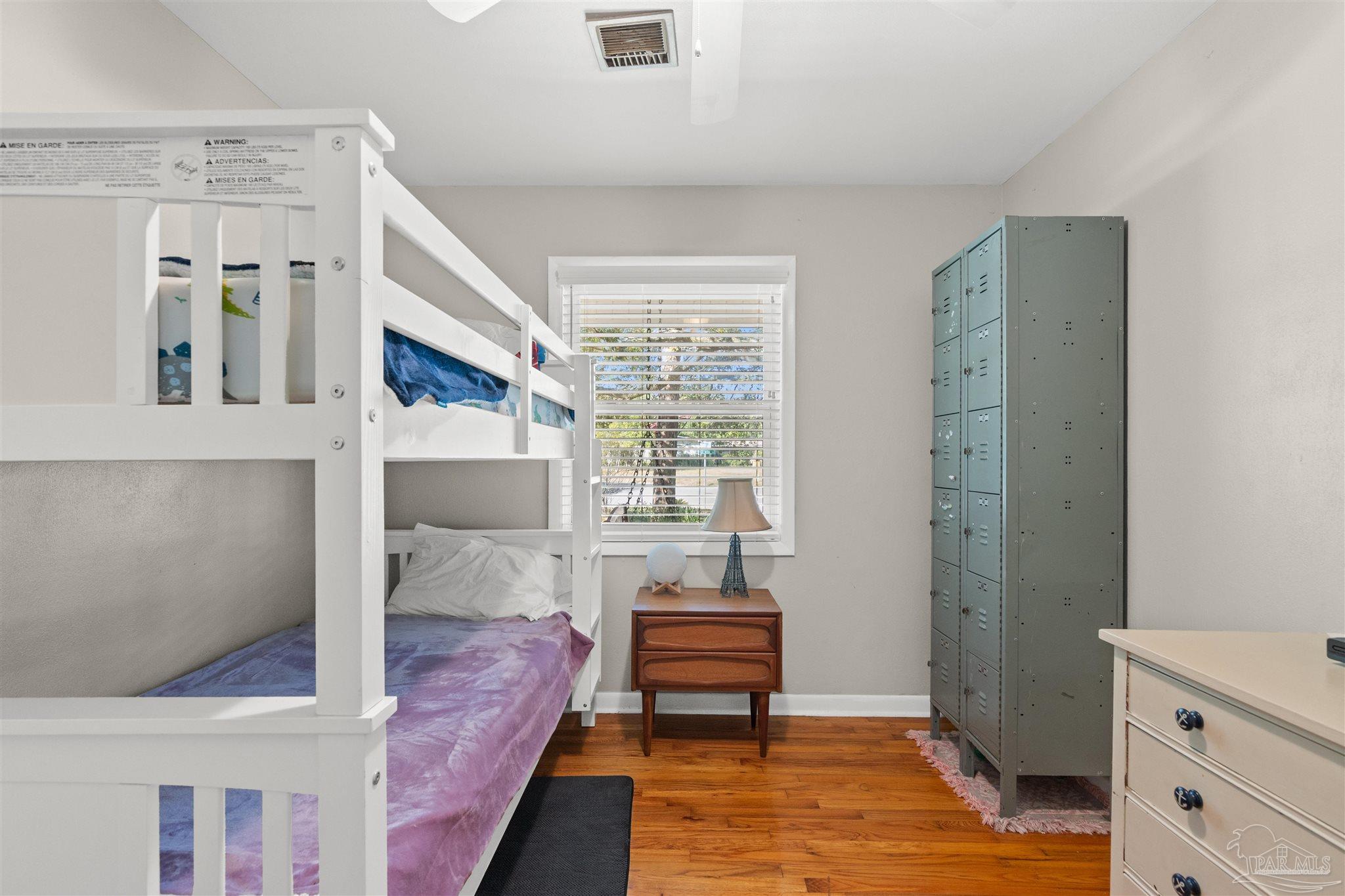 6001 Hilltop Road Pensacola, FL 32504 - Photo 22 of 37 a bedroom with a bed and a window