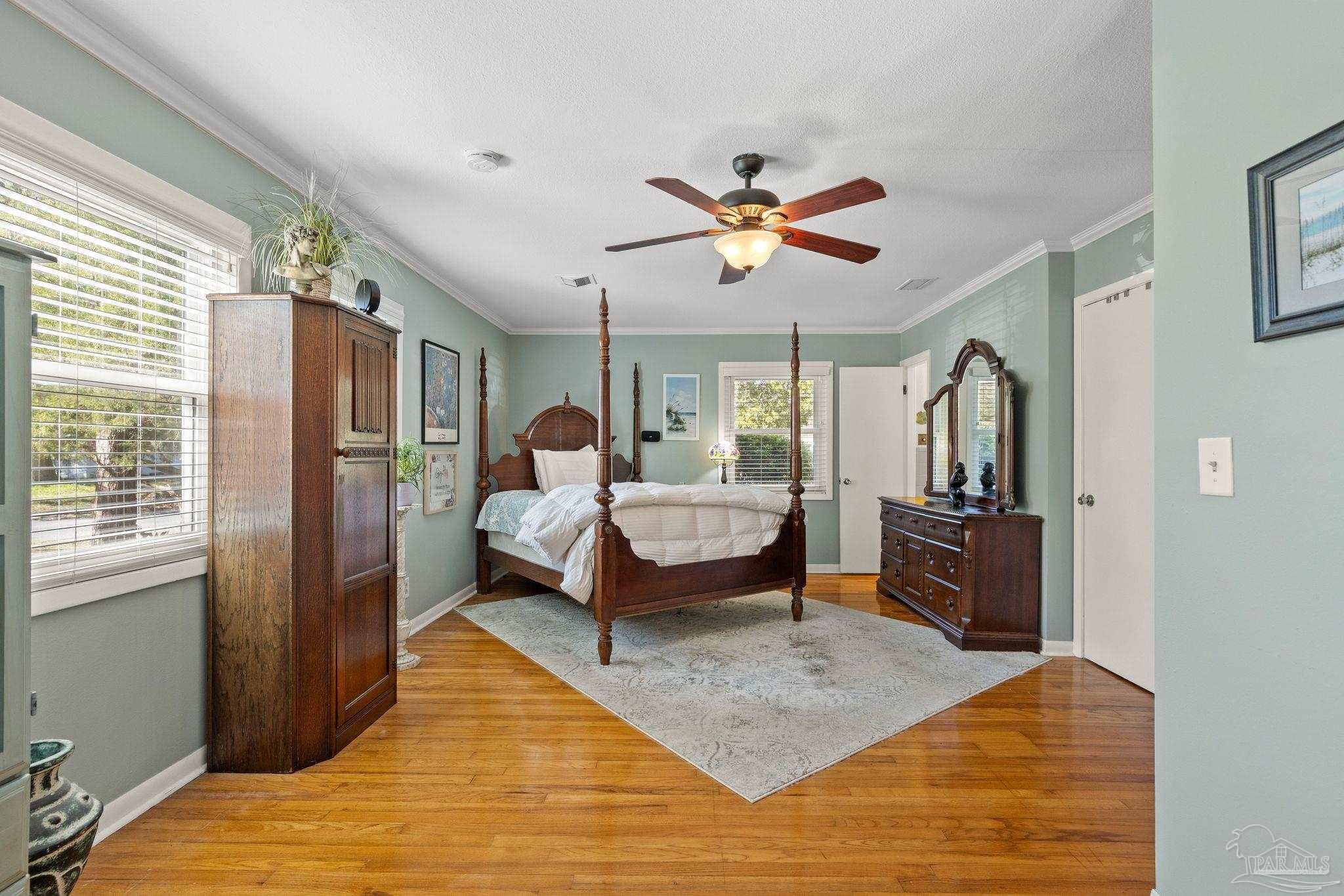 6001 Hilltop Road Pensacola, FL 32504 - Photo 23 of 37 a bedroom with a bed and wooden floor