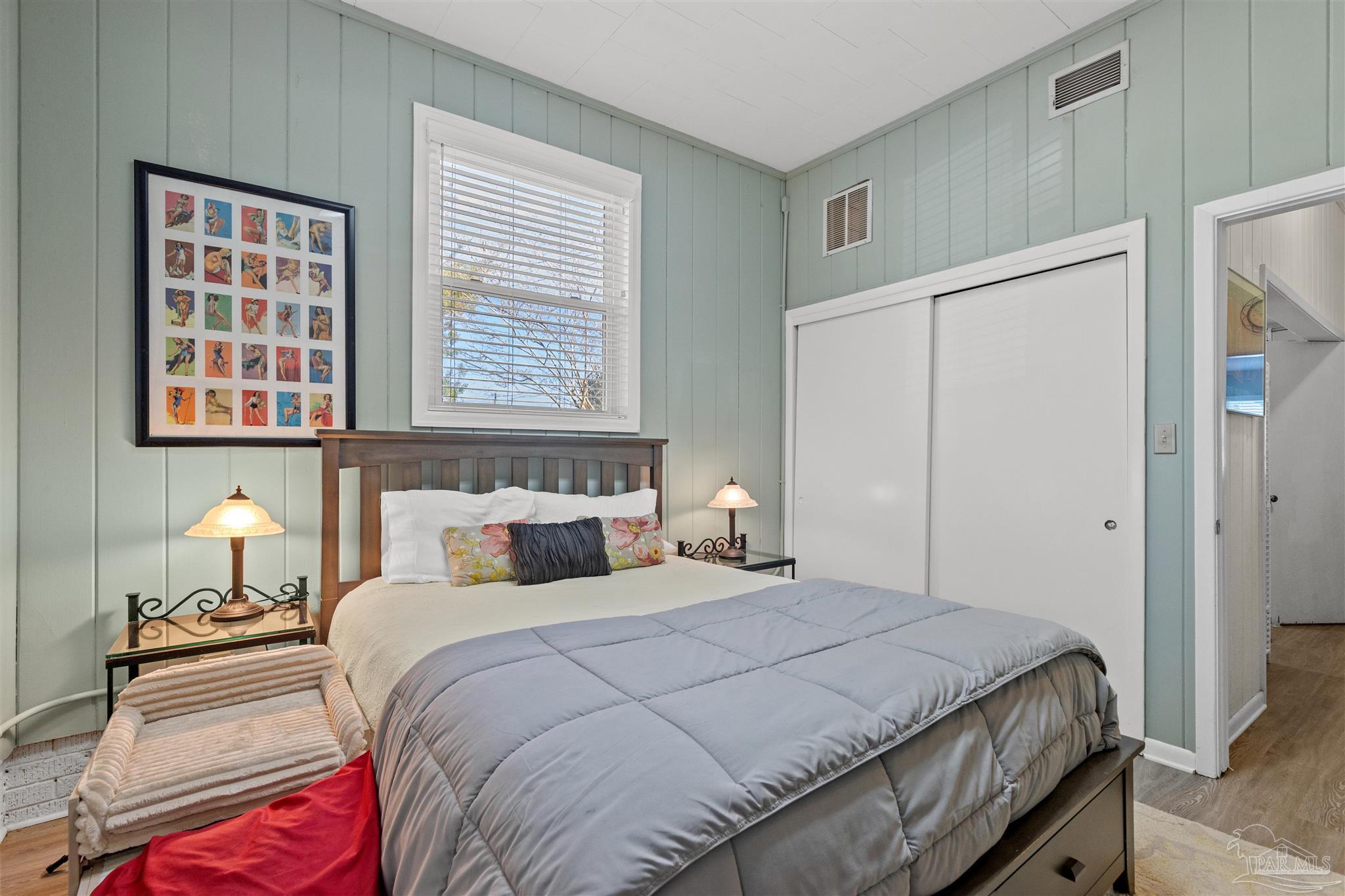 6001 Hilltop Road Pensacola, FL 32504 - Photo 27 of 37 a bedroom with a bed and a window