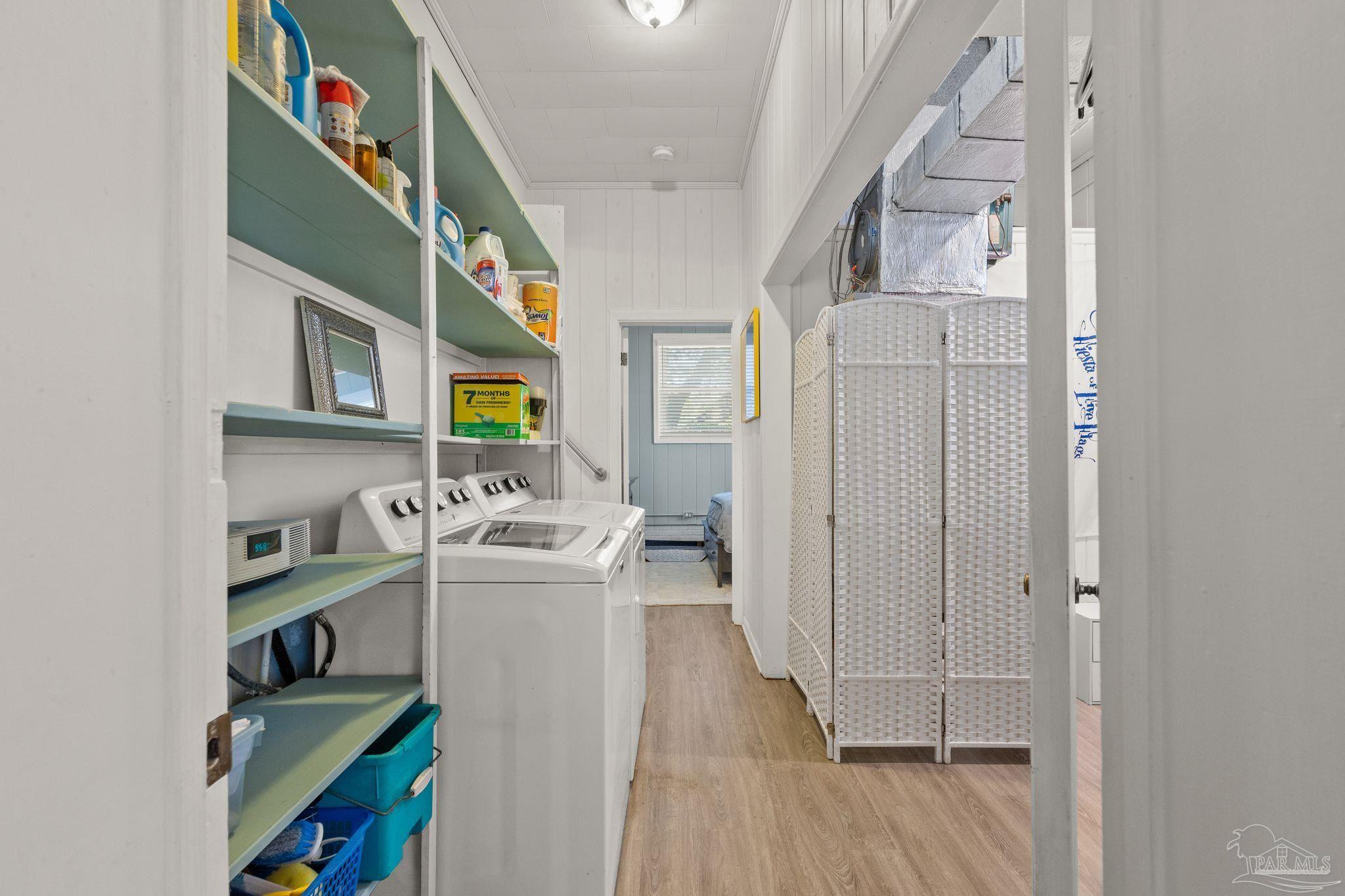 6001 Hilltop Road Pensacola, FL 32504 - Photo 30 of 37 a kitchen with stainless steel appliances granite countertop a stove and a wooden floor