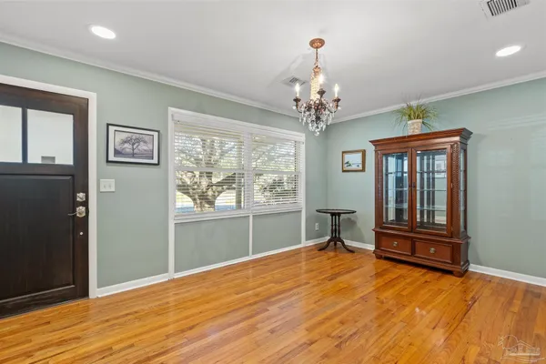 a kitchen with stainless steel appliances granite countertop a refrigerator sink and cabinets