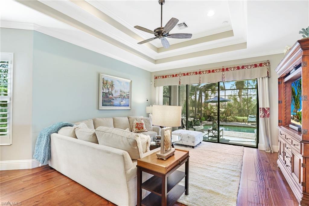 7599 Moorgate Point Way Naples, FL 34113 - Photo 12 of 38 a living room with furniture and a window