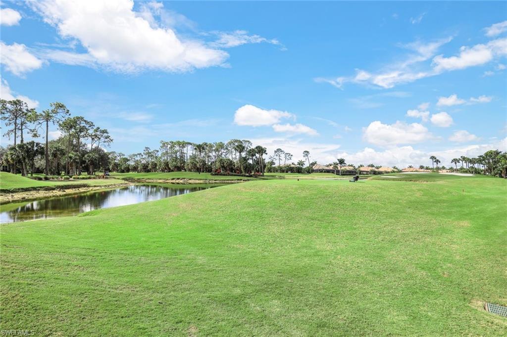 7599 Moorgate Point Way Naples, FL 34113 - Photo 31 of 38 a view of a lake with houses in the background
