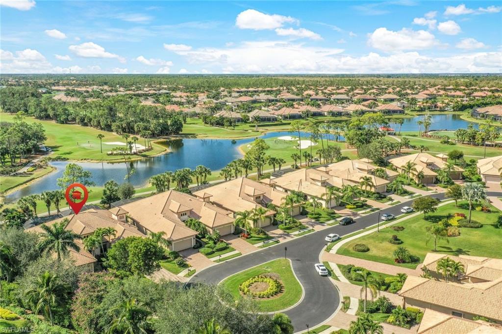 7599 Moorgate Point Way Naples, FL 34113 - Photo 33 of 38 an aerial view of residential houses with outdoor space and river