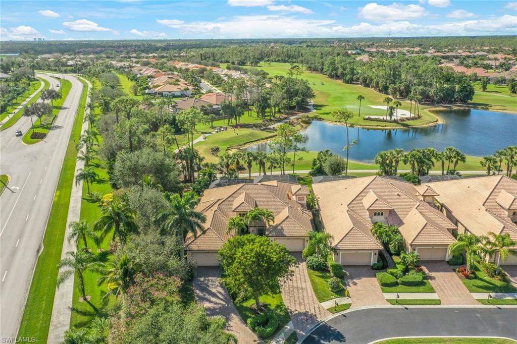 7599 Moorgate Point Way Naples, FL 34113 - Photo 34 of 38 an aerial view of residential houses with outdoor space and ocean view