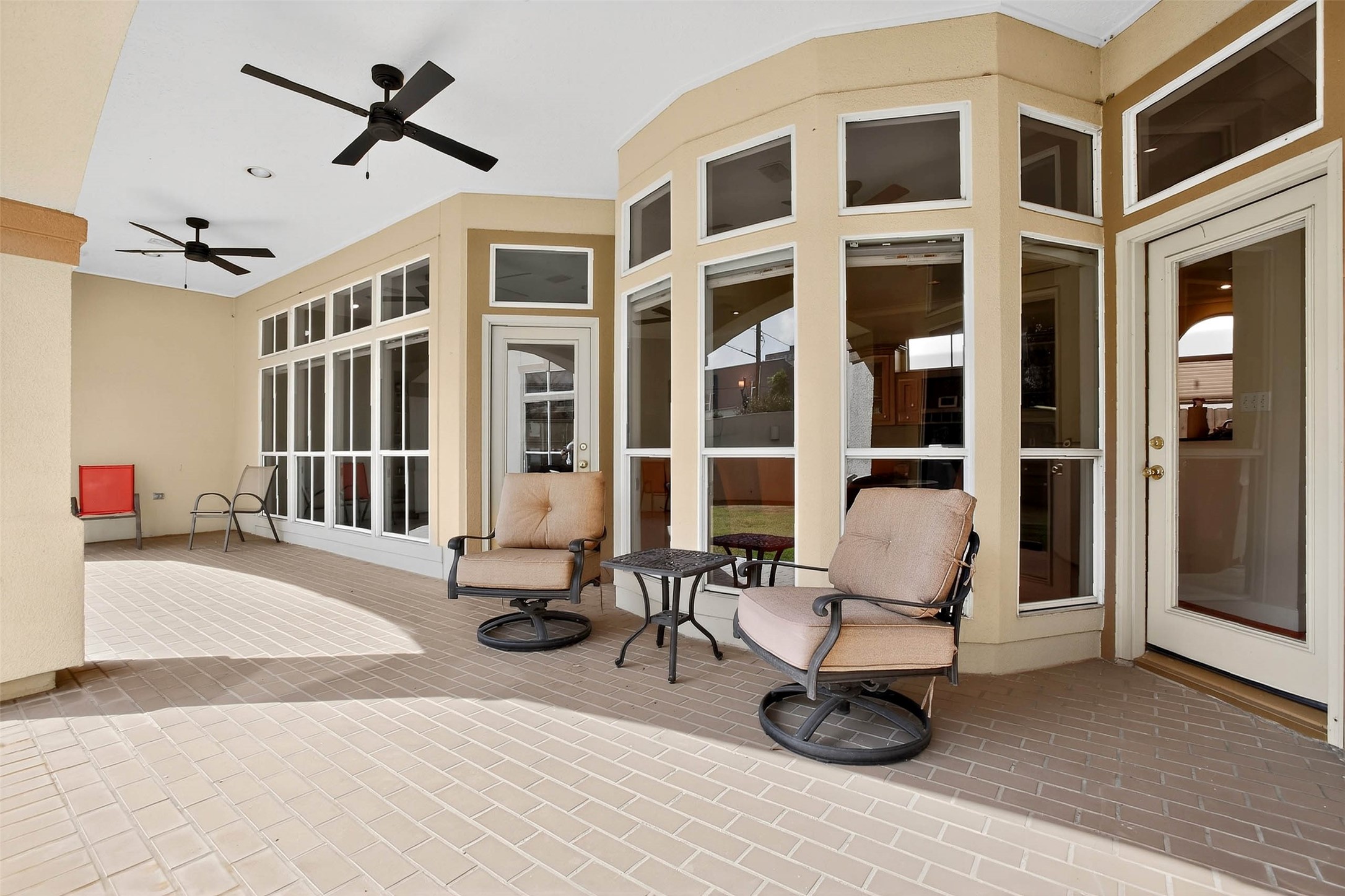 3118 Virginia Street Houston, TX 77098 - Photo 45 of 50 Another photo of the outdoor living room located off the living room and kitchen with walls of windows.