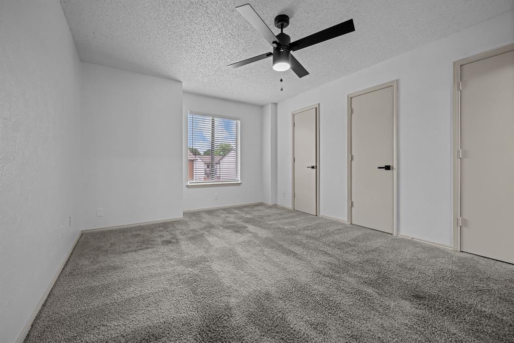 151 East Little Creek Road Cedar Hill, TX 75104 - Photo 4 of 7 an empty room with windows and ceiling fan