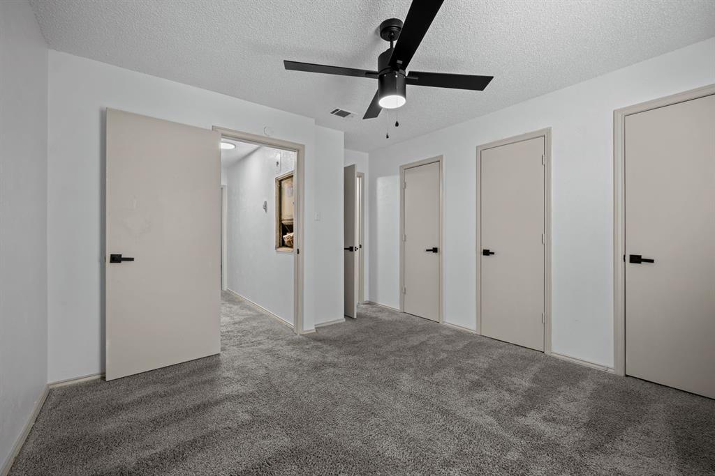 151 East Little Creek Road Cedar Hill, TX 75104 - Photo 6 of 7 a view of a hallway with a chandelier fan