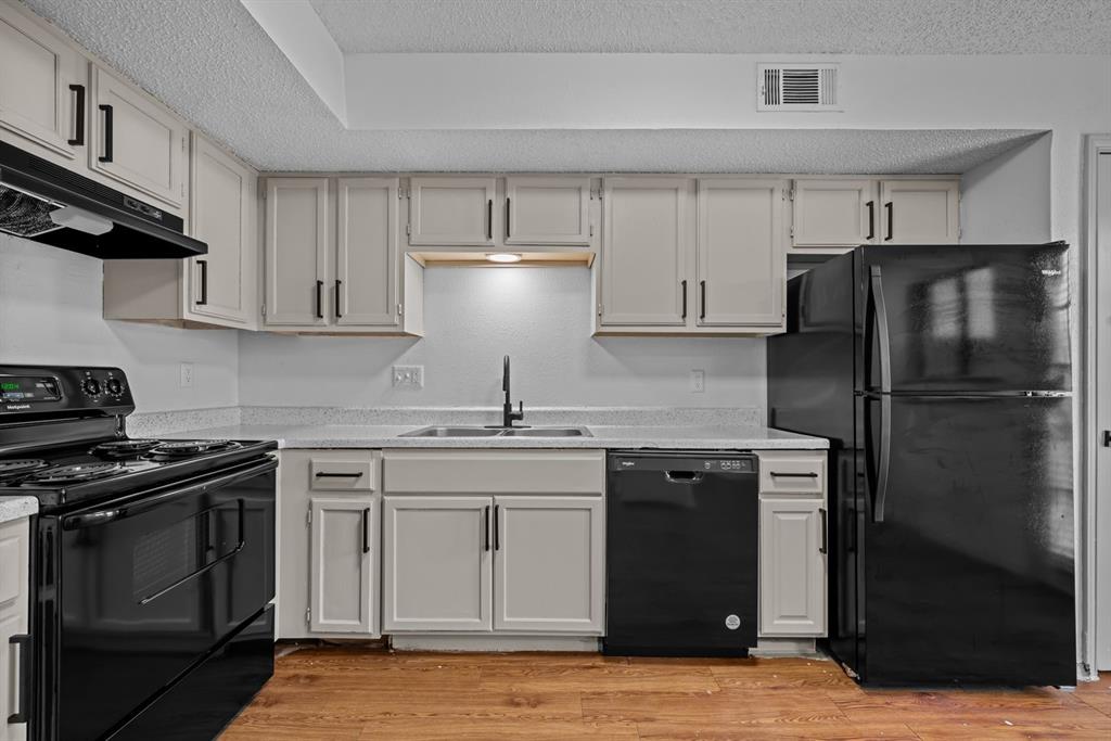 151 East Little Creek Road Cedar Hill, TX 75104 - Photo 7 of 7 a kitchen with a stove sink and refrigerator