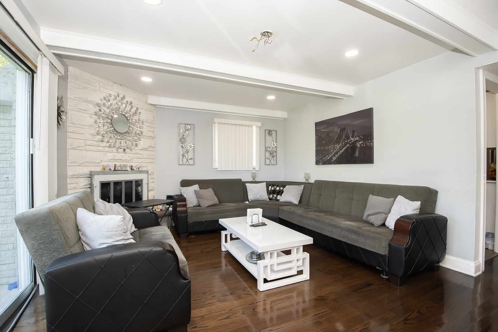 9909 North Huber Lane Niles, IL 60714 - Photo 11 of 36 a living room with furniture window and a flat screen tv