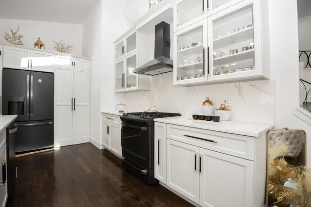a kitchen with stainless steel appliances a stove and a refrigerator