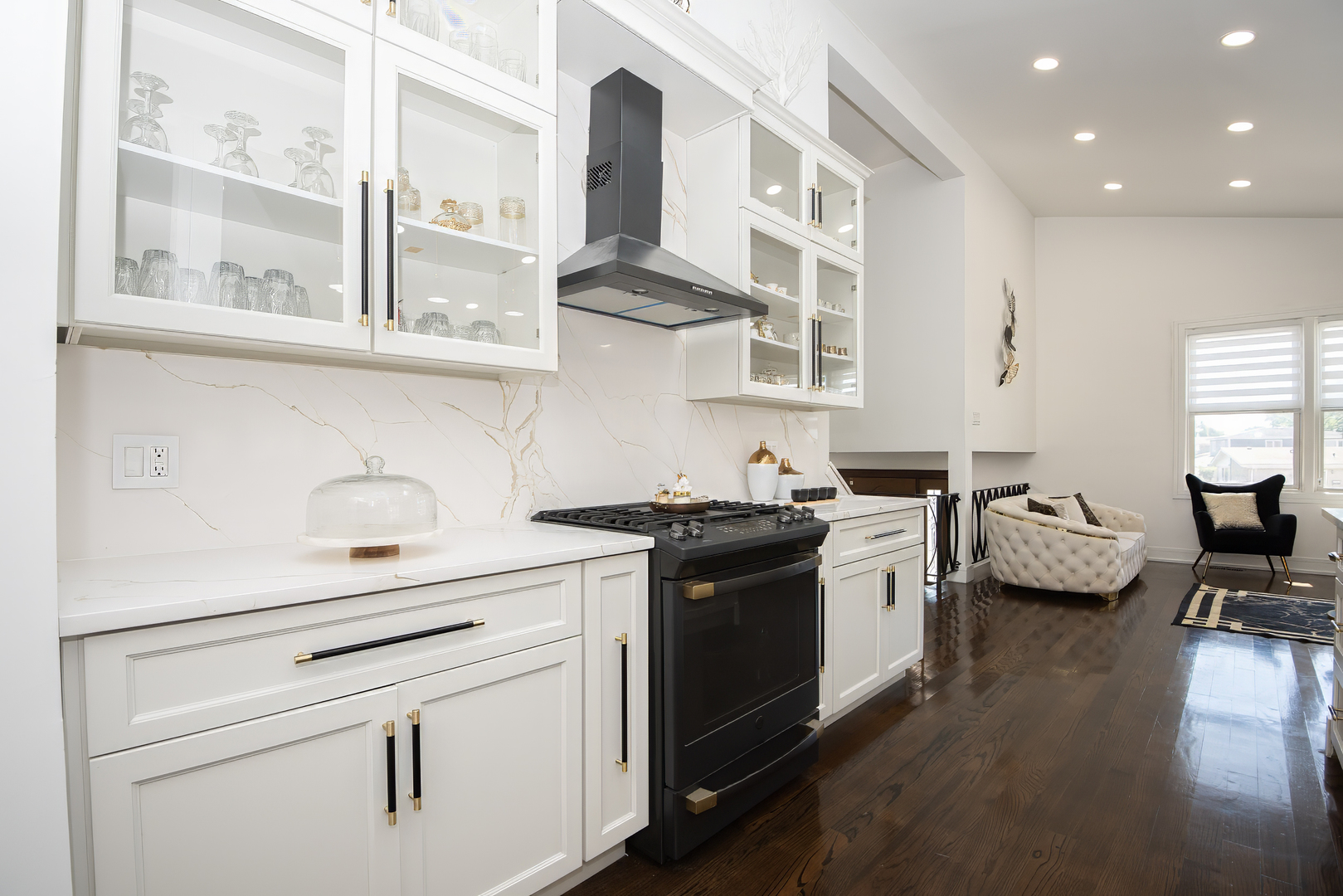 9909 North Huber Lane Niles, IL 60714 - Photo 16 of 36 a kitchen with a stove and a white cabinets