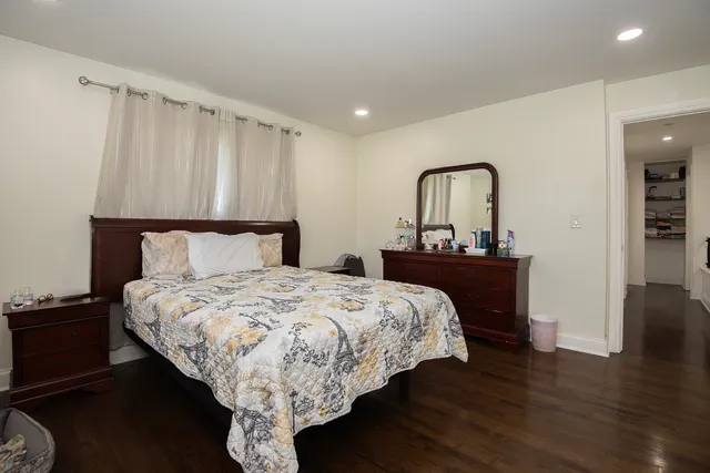 a bedroom with a bed and a closet