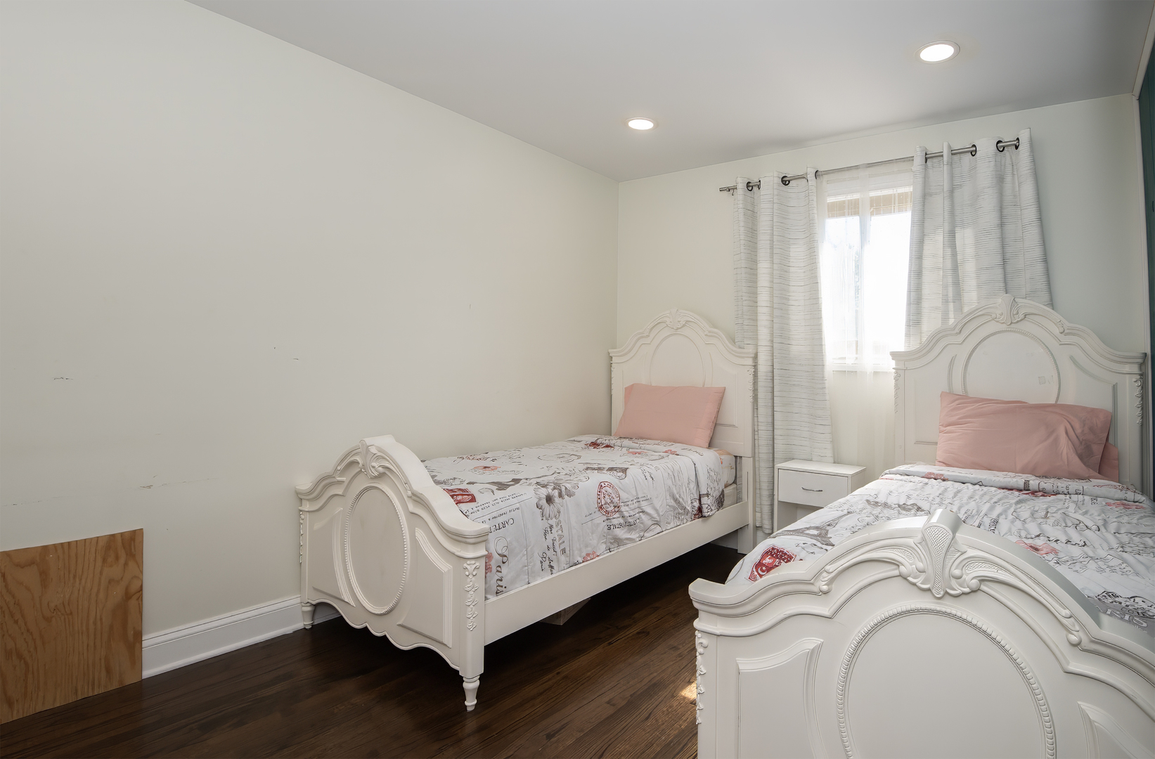 9909 North Huber Lane Niles, IL 60714 - Photo 27 of 36 a bedroom with a bed and a window