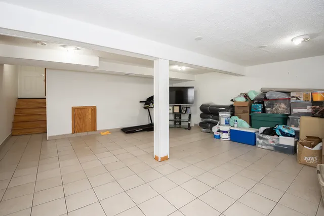 a bedroom with a bed and a shower