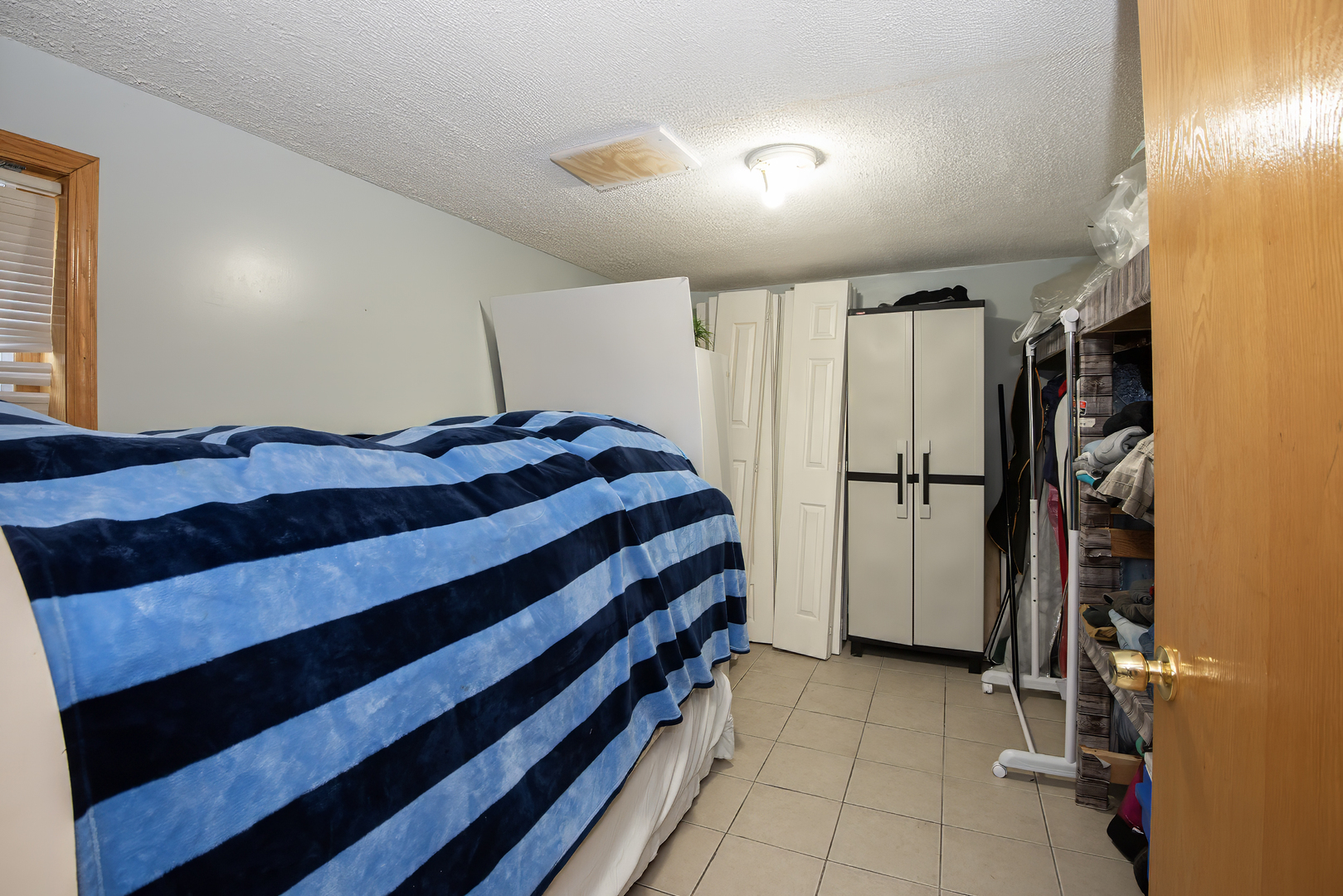 9909 North Huber Lane Niles, IL 60714 - Photo 30 of 36 a bedroom with a bed and a shower