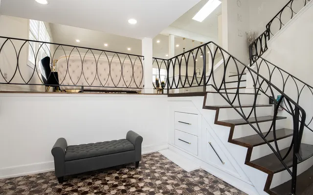 a living room with a couch and white walls
