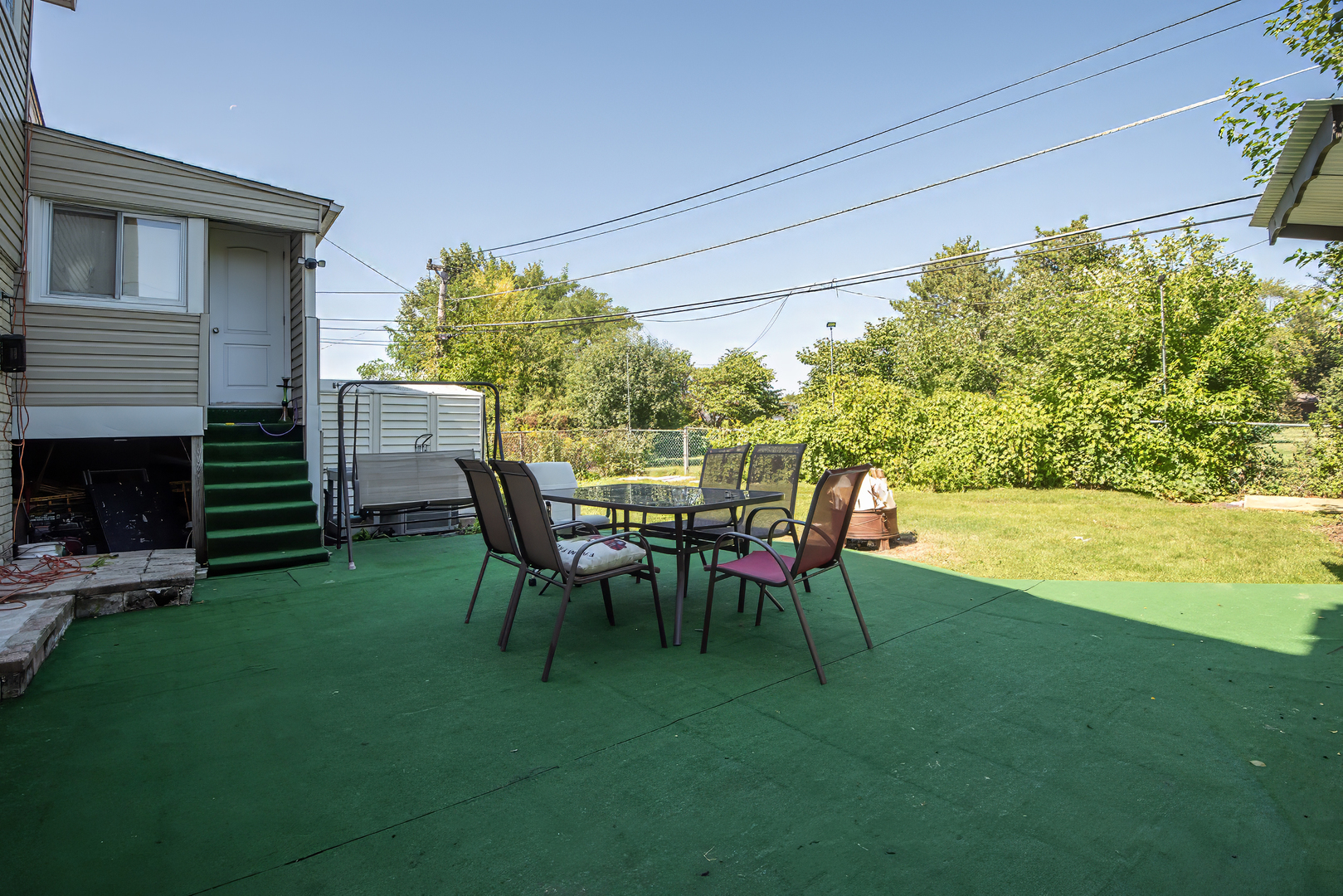 9909 North Huber Lane Niles, IL 60714 - Photo 34 of 36 a view of a chairs and table in the patio