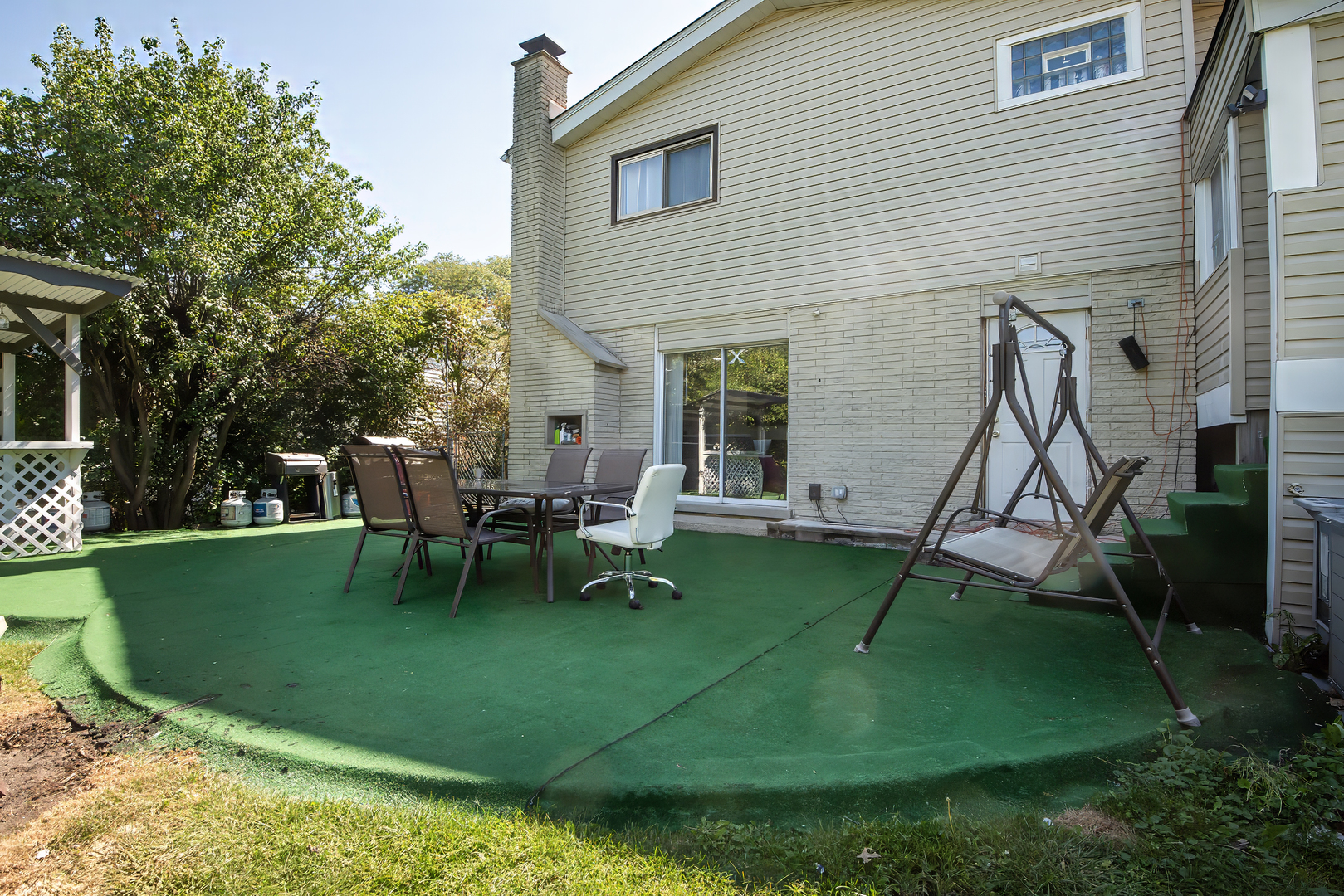 9909 North Huber Lane Niles, IL 60714 - Photo 35 of 36 a view of a house with backyard