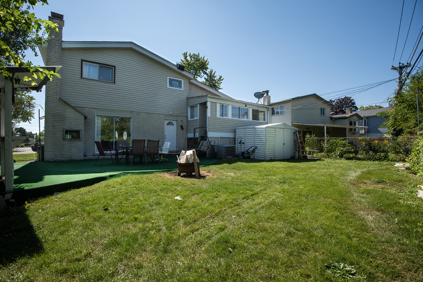 9909 North Huber Lane Niles, IL 60714 - Photo 36 of 36 a front view of a house with a yard