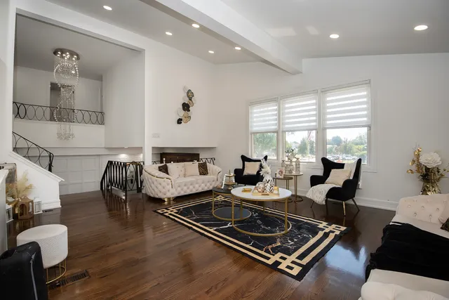 a living room with furniture rug and window