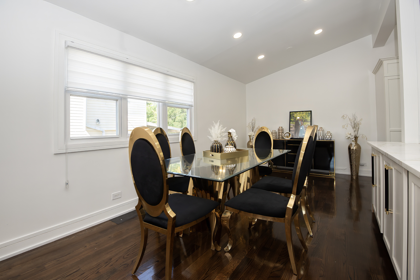 9909 North Huber Lane Niles, IL 60714 - Photo 9 of 36 a view of a dining room with furniture and wooden floor