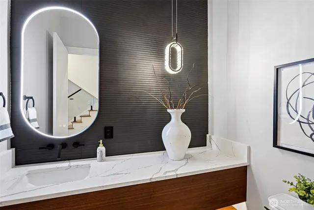 a living room with furniture and large windows