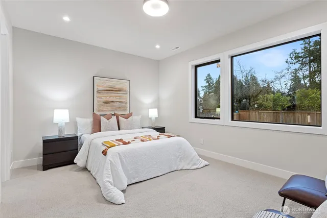 a bedroom with a bed and a lamp