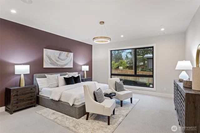 a bed room with a bed and a lamp