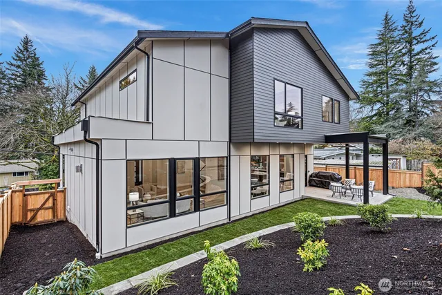 a aerial view of a house with a yard and balcony
