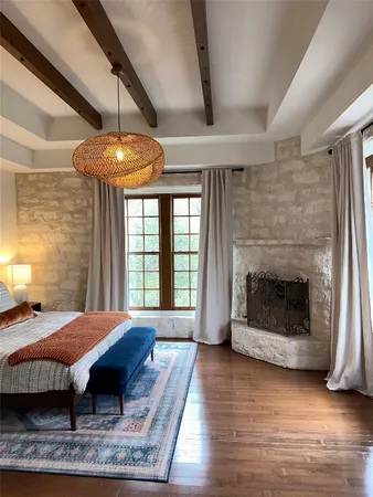a view of a livingroom with furniture window and wooden floor