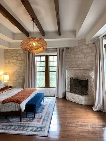a view of a livingroom with furniture window and wooden floor
