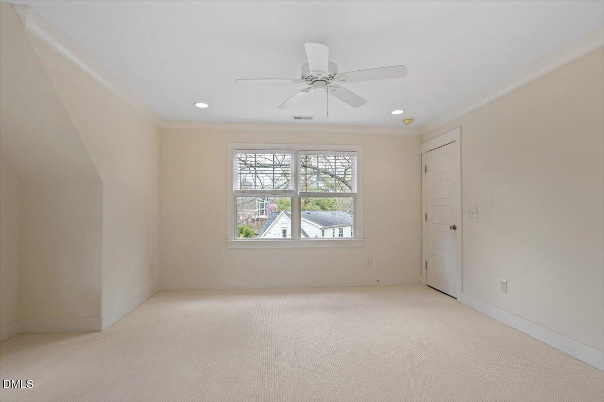 2718 Peachtree Street Raleigh, NC 27608 - Photo 22 of 38 wooden floor in an empty room with a window
