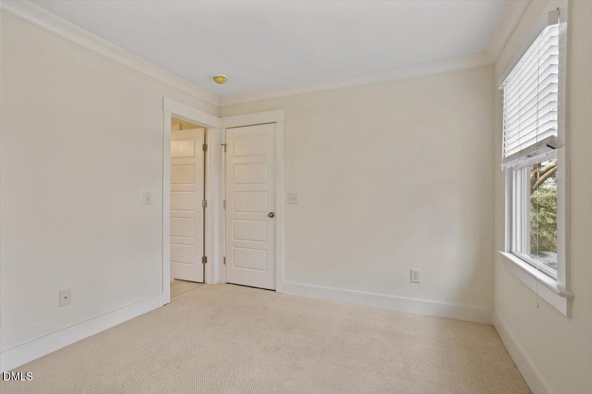 2718 Peachtree Street Raleigh, NC 27608 - Photo 27 of 38 an empty room with windows and closet