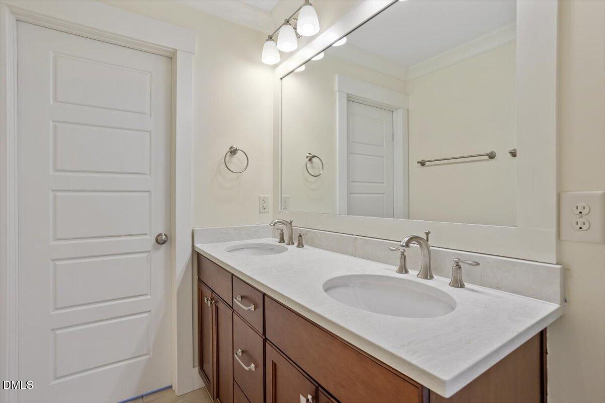 2718 Peachtree Street Raleigh, NC 27608 - Photo 28 of 38 a bathroom with a sink and a mirror