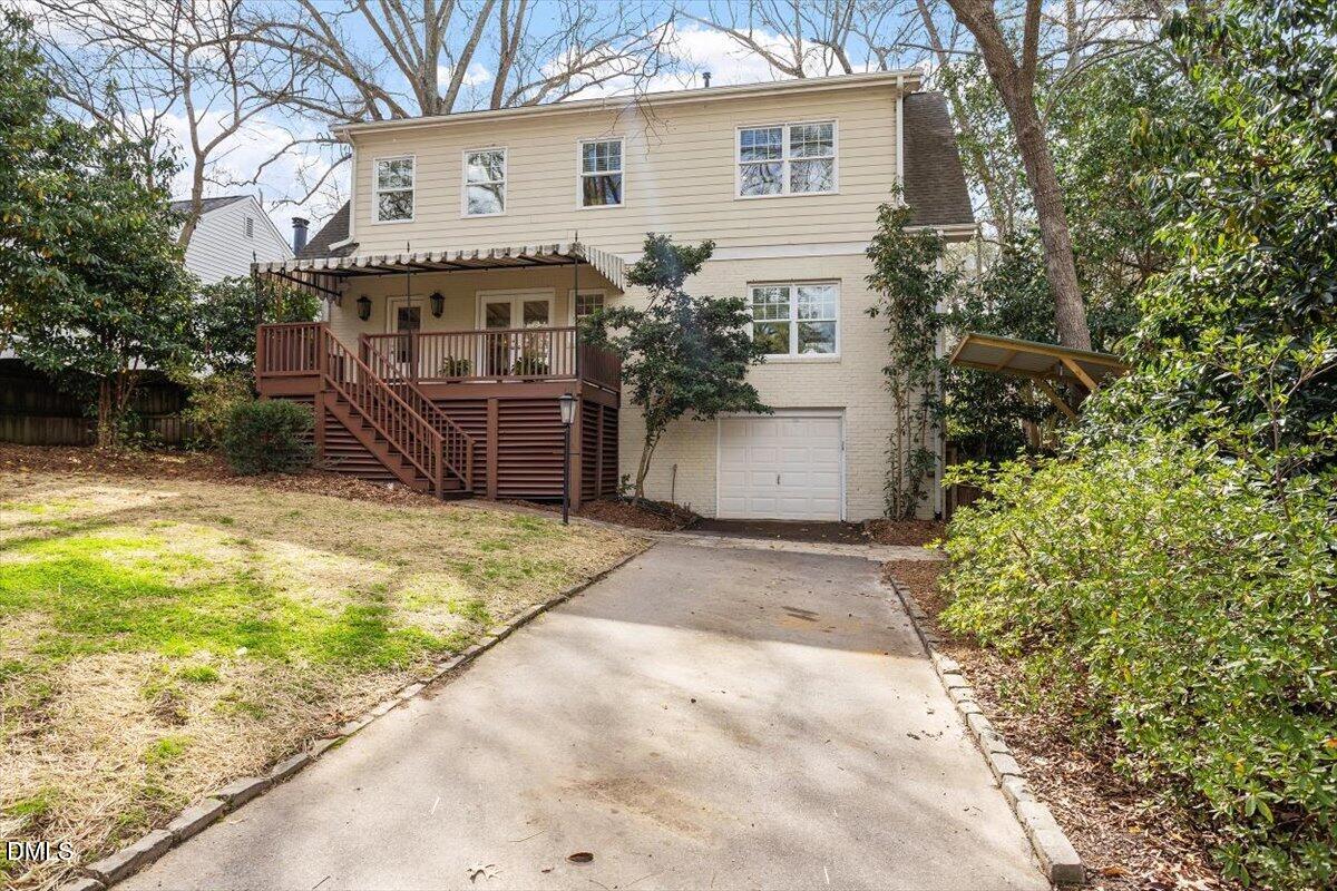 2718 Peachtree Street Raleigh, NC 27608 - Photo 32 of 38 a view of a house with a yard