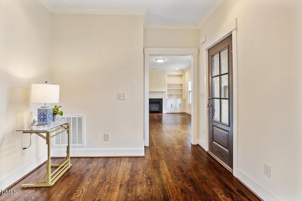 2718 Peachtree Street Raleigh, NC 27608 - Photo 7 of 38 wooden floor in an empty room and a mirror